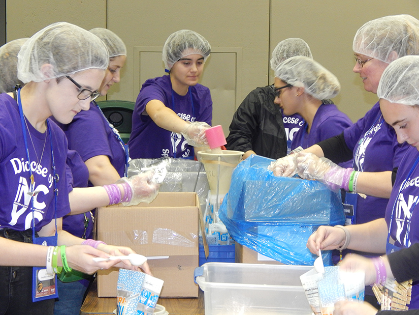 Teenagers from the Diocese of Springfield, Mass., put together meals Nov. 23 during the National Catholic Youth Conference in Indianapolis. The meals were for Pack Away Hunger, an Indianapolis-based organization that provides nutritious dehydrated meals to local food pantries throughout Indiana. The organization also works with international populations.