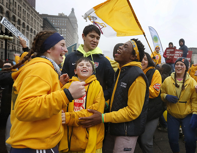 Members of the “Crusaders for Life” from St. John Cantius Parish in Chicago cheered Jan. 11 at the end of March for Life Chicago.