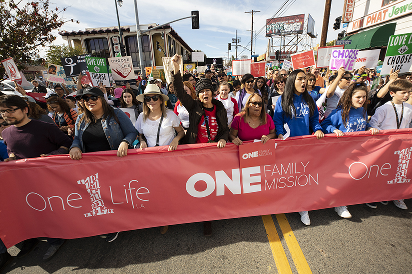 Pro-life advocates marched during the OneLife LA rally Jan. 18 in Los Angeles. The event was one of many held across the country to mark the Jan. 22 anniversary of the U.S. Supreme Court’s 1973 decision legalizing abortion. Thousands participated in the walk, which took marchers through Chinatown to the Los Angeles State Historic Park, where the crowd gathered for a rally. During the walk, parts of the group prayed the Rosary or sang aloud hymns such as “How Great Thou Art.” Some chanted a refrain: “We are … pro-life! Pro-life generation!”