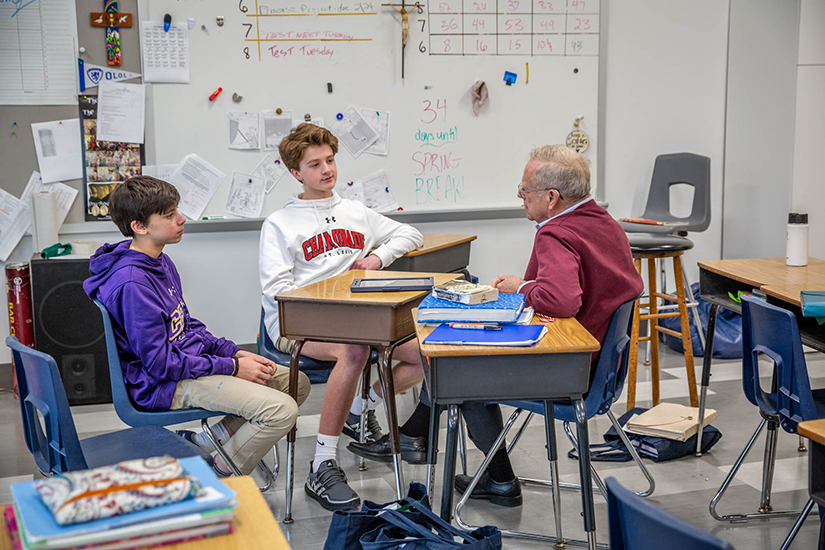 Eighth-graders Teddy Malecek and Ben Dryden interviewed John Rasp about his faith for part of their confirmation preparation at Our Lady of Lourdes School in University City on Feb 10.