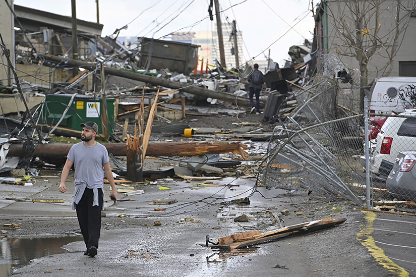 A man viewed damage in an alley after a tornado touched down in Nashville, Tenn., March 3.
