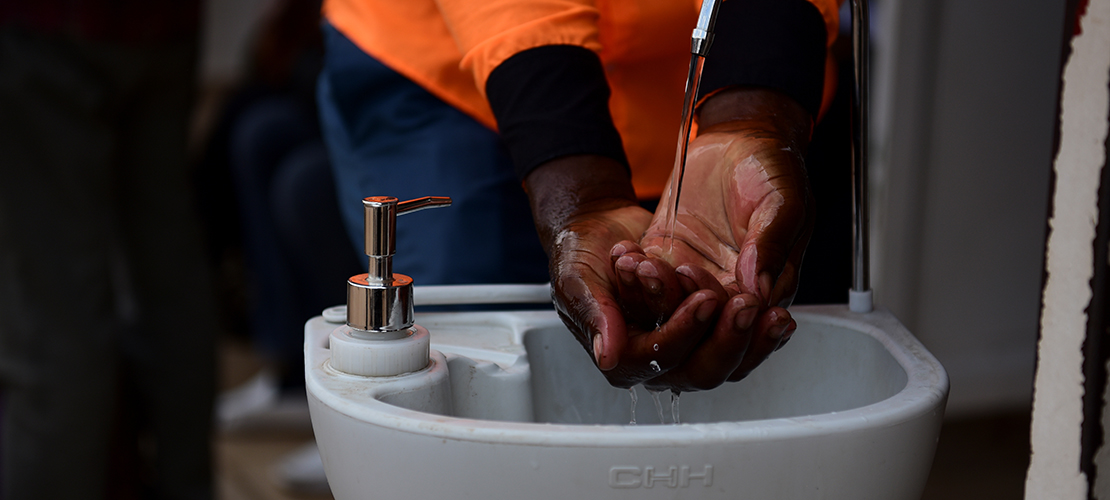 A man washed his hands at a public hand-washing station before boarding a bus as a cautionary measure against the coronavirus in Kigali, Rwanda, March 11.