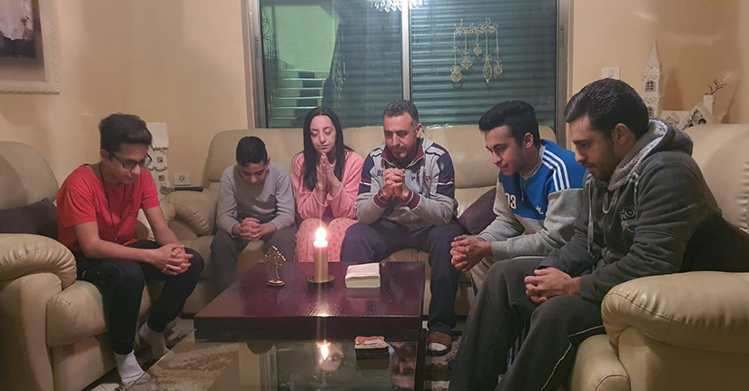 George and Randa Sabat and their four children prayed at home during the coronavirus lockdown in Bethlehem, West Bank, March 17. “Even though we already have a good relationship with the Church, during this difficult time our connection has become even better,” George Sabat said.