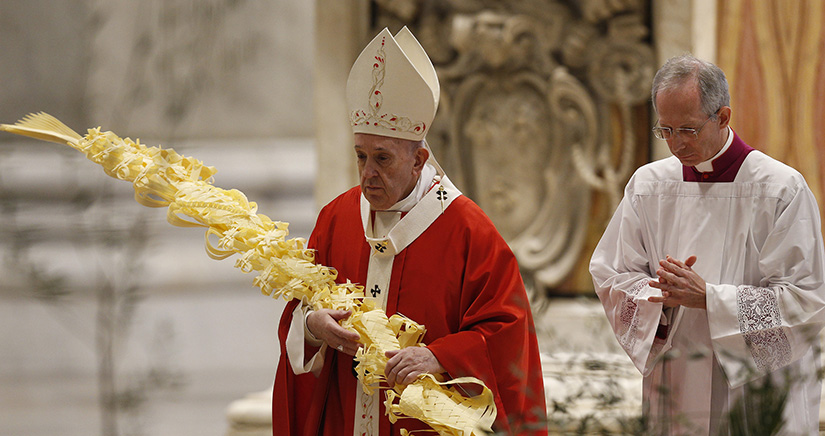 Pope Francis processed with palm fronds at Palm Sunday Mass in St. Peter’s Basilica at the Vatican April 5. The Mass was celebrated without the presence of the public.