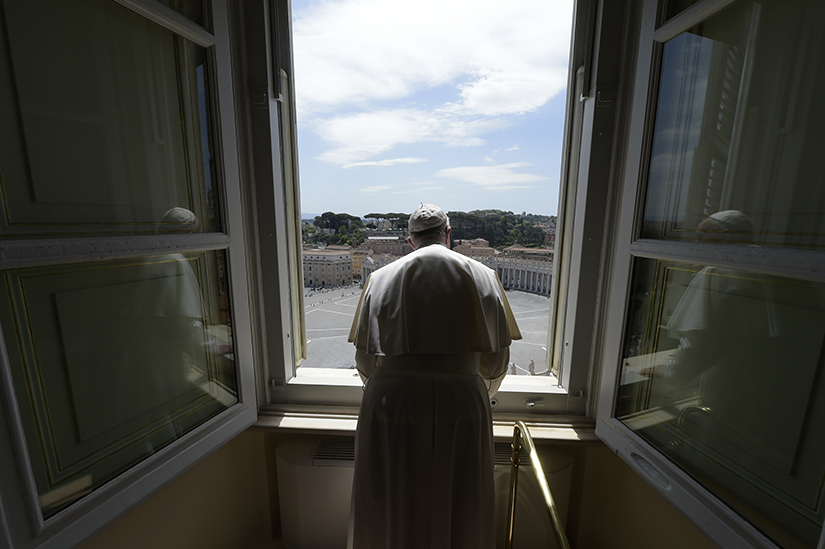 Pope Francis looked out over an empty St. Peter’s Square after leading the “Regina Coeli” prayer from his library in the Apostolic Palace at the Vatican May 10. The Sunday prayer took place without the physical presence of the faithful due to the coronavirus pandemic.