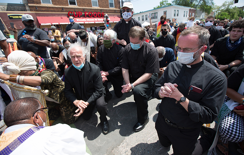 Catholic priests from the Archdiocese of St. Paul and Minneapolis joined clergy of other religious denominations June 2 to pray at the site where George Floyd was pinned down May 25 and died at the hands of a Minneapolis police officer. Pictured are Father Joe Gillespie, Father Doug Ebert, Father Kevin Finnegan, Father Brian Park and Father Peter Williams.
