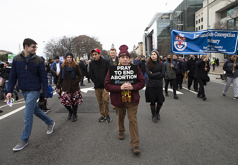 People walked up Constitution Avenue headed toward the U.S. Supreme Court while participating in the 47th annual March for Life in Washington Jan. 24. A recent study by the University of Notre Dame attempted to gage respondents attitudes toward abortion and their reasons for those attitudes.
