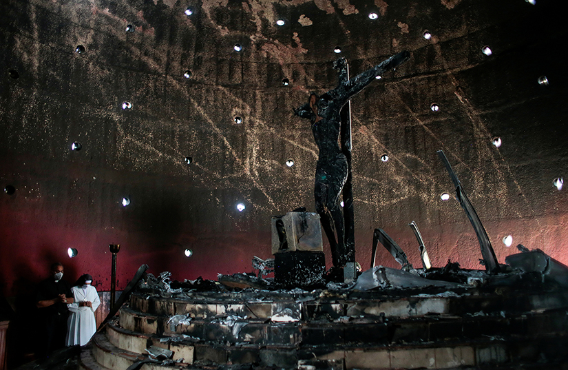 A priest and nun prayed in the Blood of Christ Chapel at the Metropolitan Cathedral in Managua, Nicaragua, July 31 after the chapel was destroyed in an arson attack.