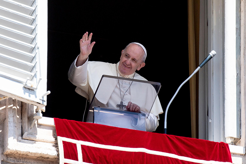Pope Francis greeted the crowd as he led the Angelus from the window of his studio overlooking St. Peter’s Square at the Vatican Aug. 23. The pope prayed for people persecuted for their faith, remembered the victims of the 2010 San Fernando massacre in Mexico and prayed for the victims of COVID-19.