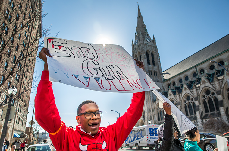 Alandon Pitts, a sophomore at Cardinal Ritter College
Preparatory High School, chanted “put down the gun, pick
up a book” as he walked along Lindell Boulevard, near
St. Francis Xavier “College” Church in Midtown, on March
14. Pitts was among Ritter students who participated in a
national day of protest day against gun violence.