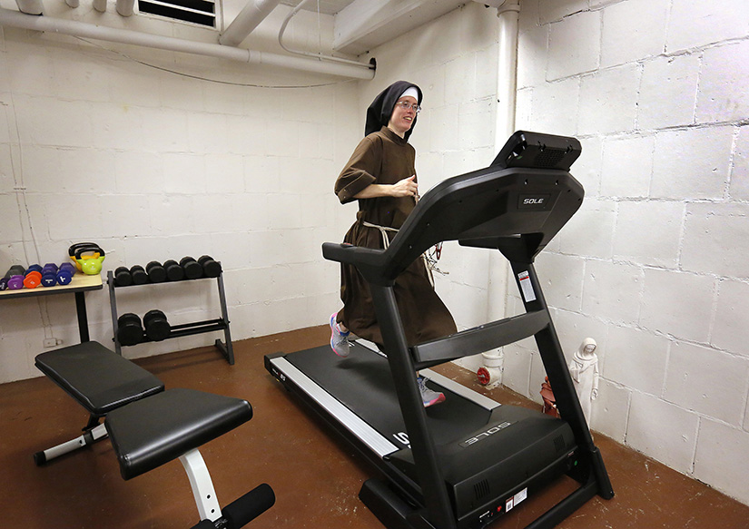 Sister Stephanie Baliga, a Franciscan Sister of the Eucharist of Chicago, trained on a treadmill in the basement of her community’s convent Aug. 15. On Aug. 23, she ran a marathon on the treadmill to raise money for the Mission of Our Lady of the Angels and set a world record for women’s treadmill marathoning.