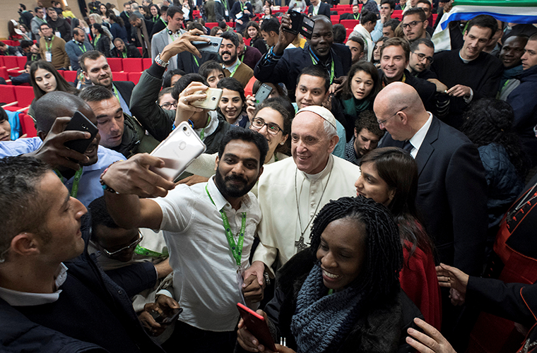 Pope Francis posed for a selfie at a pre-synod gathering of youth delegates at the Pontifical International Maria Mater Ecclesiae College in Rome March 19. The meeting was in preparation for the Synod of Bishops on young people, the faith and vocational discernment this October at the Vatican.