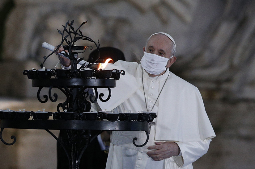 Pope Francis lit a candelabra at the conclusion of an encounter to pray for peace in Piazza del Campidoglio in Rome Oct. 20. The only way to end war and ensure humanity’s survival is “through encounter and negotiation, setting aside our conflicts and pursuing reconciliation, moderating the language of politics and propaganda, and developing true paths of peace,” Pope Francis said at the ceremony. An international array of Christian, Muslim, Jewish, Sikh and Buddhist leaders gathered on Rome’s Capitoline Hill Oct. 20 to affirm their community’s commitment to peace, dialogue, fraternity and assistance to the poor and needy.