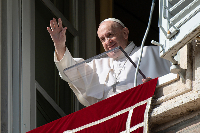 Pope Francis greeted the crowd as he led the Angelus from the window of his studio overlooking St. Peter’s Square at the Vatican Oct. 25.
