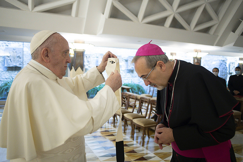 Pope Francis bestowed the pallium on Archbishop Pierbattista Pizzaballa during a private ceremony in the chapel of the Domus Sanctae Marthae at the Vatican Oct. 28. The pope bestowed the pallium days after Archbishop Pizzaballa was appointed as the 10th Latin patriarch of Jerusalem.
