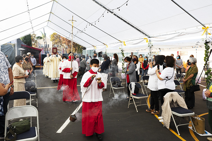 Father Juan Ochoa, administrator of Christ the King Church near Hancock Park, California in the Los Angeles area, processed during the opening Mass Nov. 22, on the solemnity of his parishs namesake. The county is in the purple tier, which permits worship services only outside.