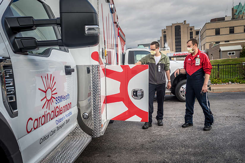 Nicholas Petz and Scott Buckert, members of the transport team at SSM Health Cardinal Glennon Children’s Hospital, inspected the new MICU ambulances in St. Louis.