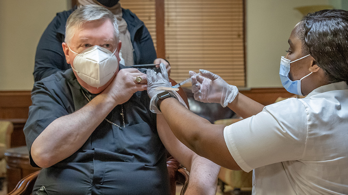 Archbishop Mitchell Rozanski received the Moderna COVID-19 vaccine at Catholic Charities of St. Louis’ Cathedral Towers building in St. Louis, Missouri on Thursday, January 14, 2021. Brittney Keller, a pharmacist for CVS clinics, administered the vaccine.