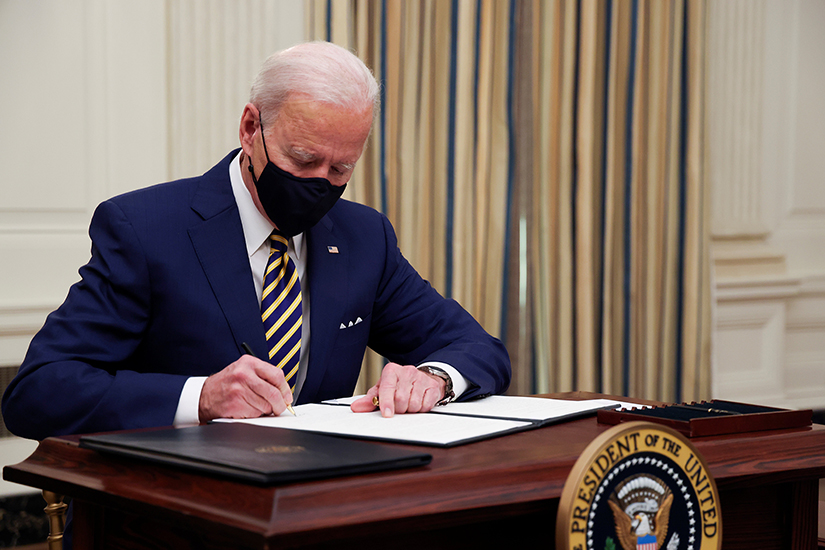 President Joe Biden signed executive orders at the White House in Washington Jan. 22 after speaking about his administration's plans to respond to the economic crisis during the coronavirus pandemic.