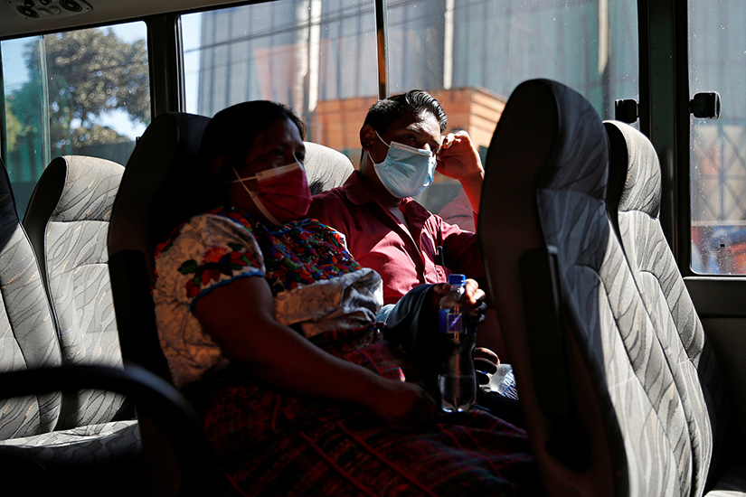 Guatemalans who fear their relatives were among 19 charred bodies in two burned-out vehicles found in Camargo, Mexico, departed the Faculty of Medicine in Guatemala City Jan. 25. They gave DNA samples to help in the identification.