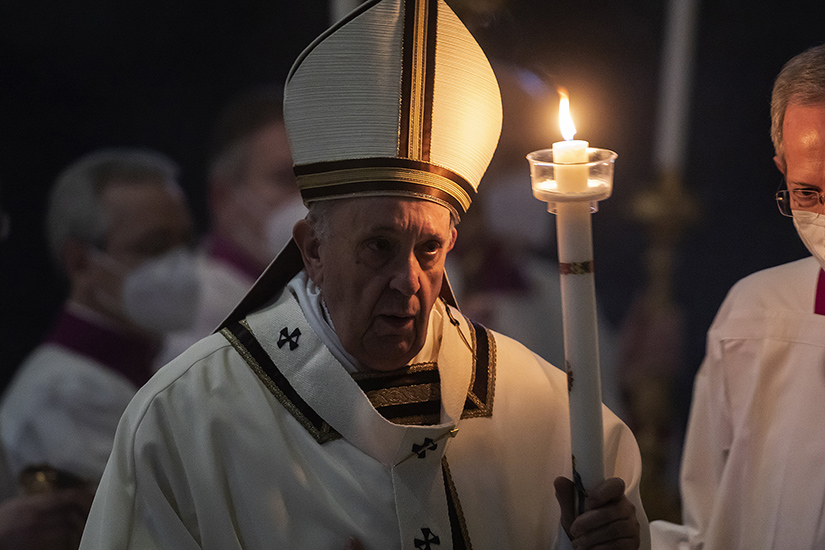 Pope Francis held a candle as he celebrated Mass marking Candlemas and the World Day for Consecrated Life in St. Peter’s Basilica at the Vatican Feb. 2.