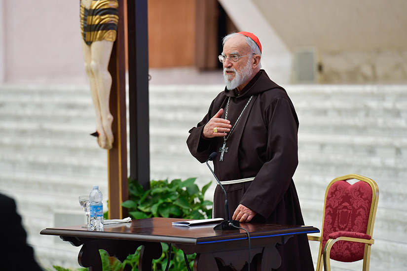 Cardinal Raniero Cantalamessa, preacher of the papal household, presents Lenten meditations for members of the Roman Curia and Vatican employees in the Paul VI hall at the Vatican Feb. 26.