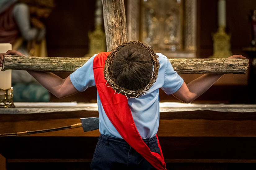 Fourth-grader Levi Fallert played the role of Jesus and hung upon the cross during a Living Stations of the Cross at St. Agnes Church in Bloomsdale. Levi said being part of the Living Stations of the Cross helped him reflect on Jesus “and what He’s done for us.”