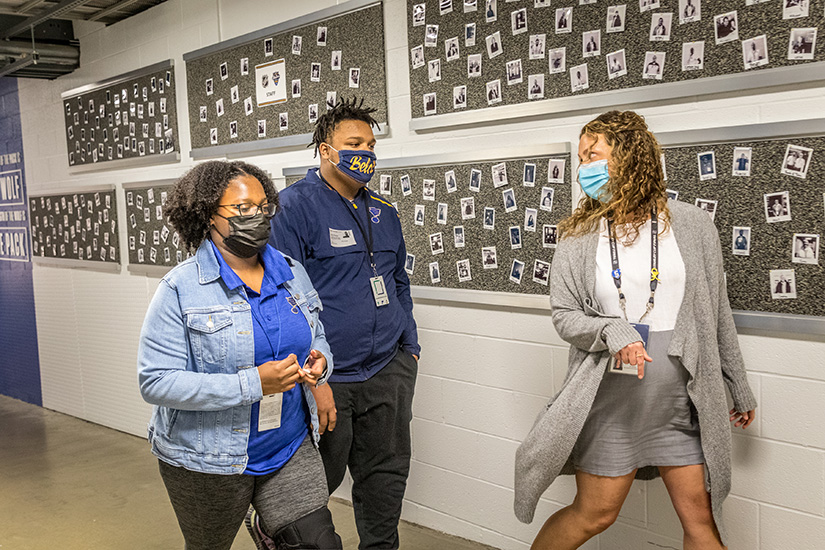 Cardinal Ritter College Prep High School students Gabrielle James and Jalen Prince, both part of an internship program with the St. Louis Blues, talked with Hannah Arnold, director of community development & Blues for Kids in the Enterprise Center.