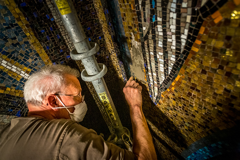 Craftsman Jim Foltz restored mosaics in the All Souls Chapel in the Cathedral Basilica of Saint Louis in St. Louis on April 14. Foltz, who has done previous restoration work on the chapel, was repairing a section of mosaics damaged by water.