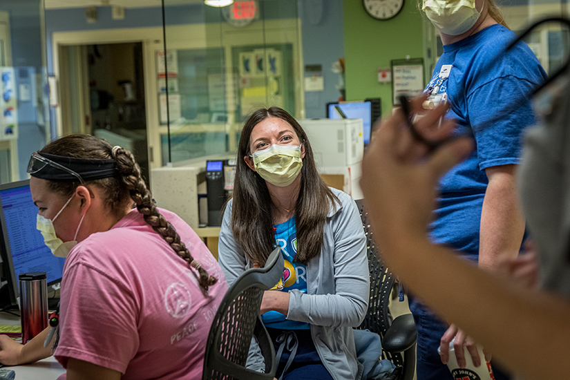 Nellie Dwyer talked with nurses as she completed her call duties at SSM Health Cardinal Glennon Children’s Hospital emergency room in St. Louis on May 6. As part of her mentor role at the hospital, Dwyer helps new staff from orientation and beyond.