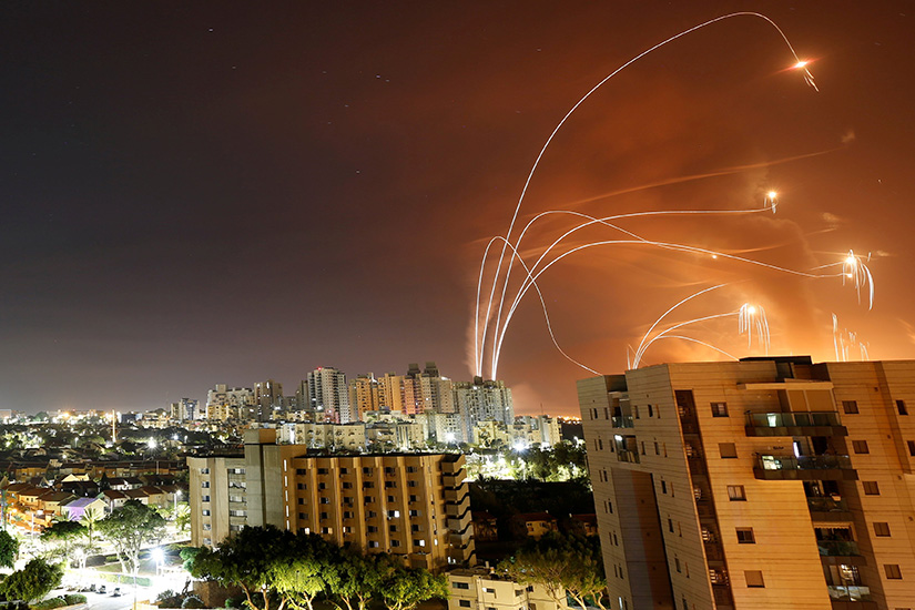 Streaks of light are seen as an Israeli Iron Dome anti-missile system intercepted rockets launched from the Gaza Strip toward Israel, as seen from Ashkelon, Israel, May 12.