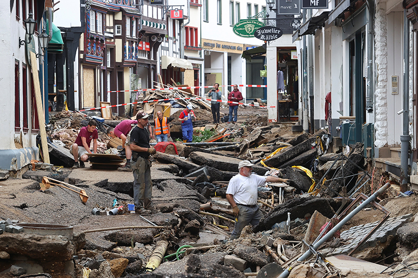People look over flood damage in Bad Munstereifel, Germany, July 19. More than 195 people have been confirmed dead, with hundreds more missing.