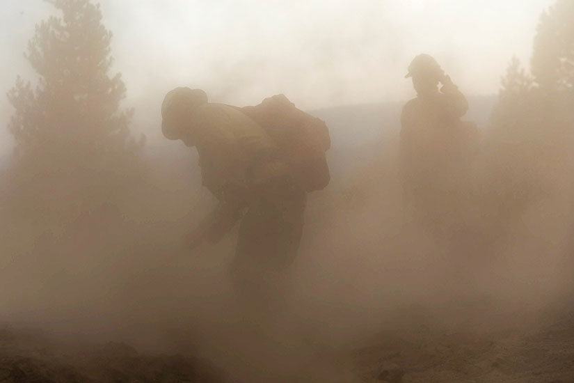 Firefighters from New Mexico worked amid heavy ash and dust to help contain the Bootleg Fire near Silver Lake, Oregon, July 29.