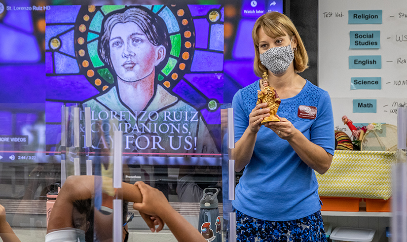 Fifth-graders learned about the Philippines and St. Lorenzo Ruiz and Santo Niño de Cebú, a Filipino representation of the Child Jesus, from their teacher, Shannon Purvis, at Seton Regional Catholic School in St. Charles in Festus on Aug. 23.