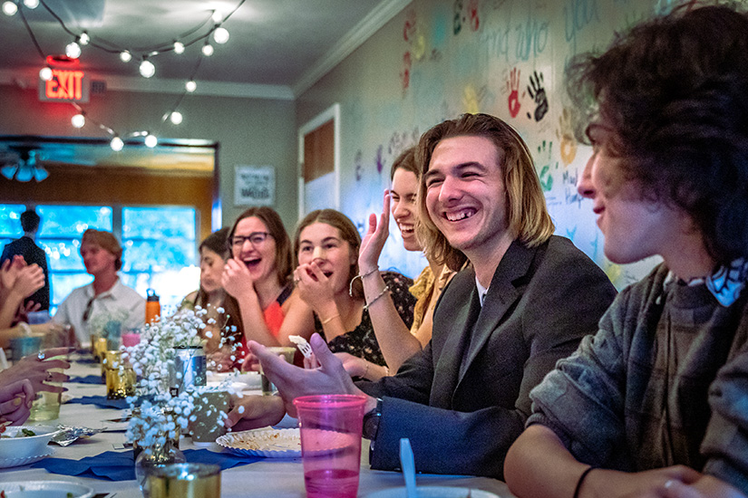 Kenneth Hammell, a new graduate of Chaminade High School, laughed with other graduating seniors in the youth group at a traditional send-off at St. Clement of Rome Parish in Des Peres