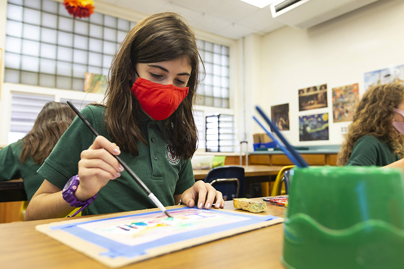 Isabella Petro, 11, painted with watercolors during a lesson with St. Ambrose School’s new fine arts program. “I go with the flow and put my feelings on an art project,” she said. “I like to talk about my art when people ask questions.”