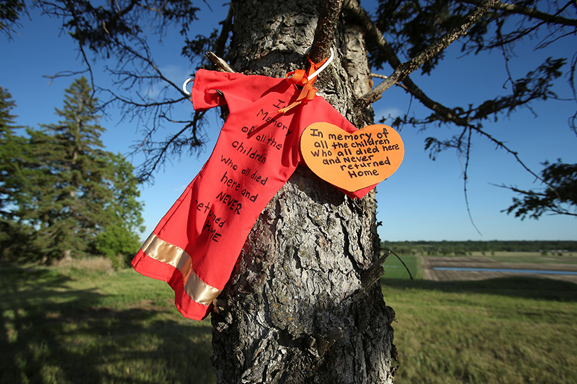 A memorial is seen at the site of the former Brandon Indian Residential School June 12. Researchers — partnered with the Sioux Valley Dakota Nation — located 104 potential graves at the site in Brandon, Manitoba. On Sept. 24, Canada’s Catholic bishops “unequivocally” apologized for the Catholic Church’s role in the residential school system.