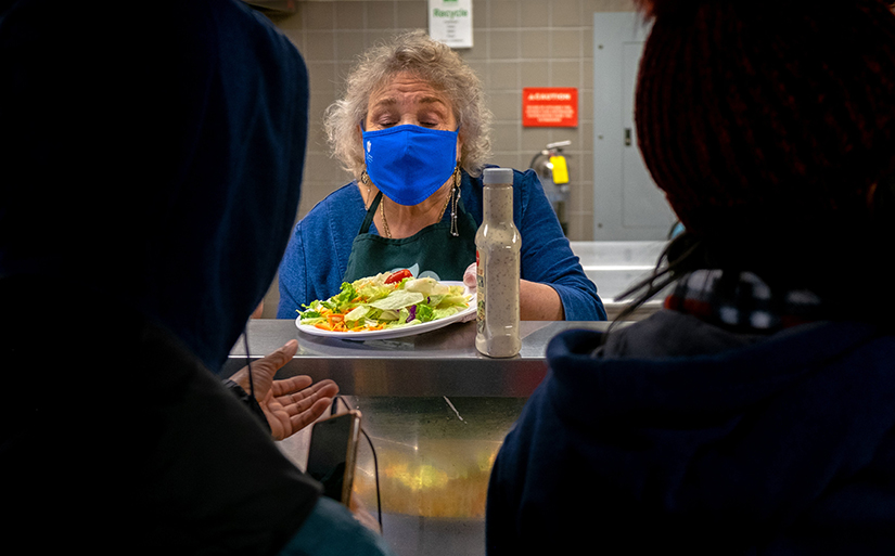 Margaret Benz served lunch to clients at St. Patrick Center in Downtown St. Louis Oct. 28. Benz, an assistant professor of nursing at Saint Louis University, has been a member of the St. Patrick Center Board of Directors since 2002.