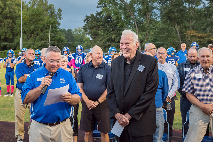 Paul Boschert, athletic director at Duchesne High School, was joined by Msgr. Tom Dempsey at a presentation before Duchesne’s homecoming game Oct. 1 honoring the late Frank Barro, who founded the football program at the school. The stadium was renamed Frank Barro Stadium. Msgr. Dempsey was on the staff at Duchesne from 1964-81.