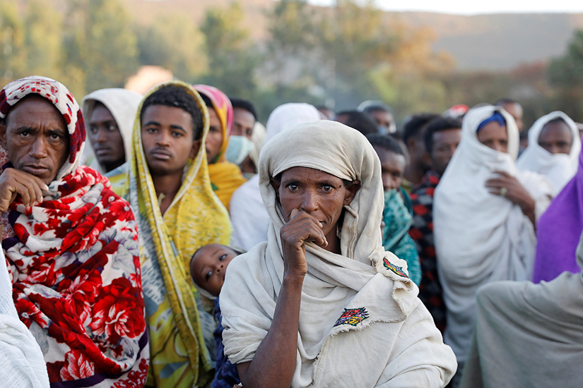 People displaced by fighting in Ethiopia’s Tigray region waited in line to receive food donations at a temporary shelter in the town of Shire March 15, 2021. The war has displaced more than 1 million people.