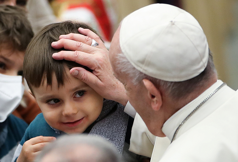 Pope Francis blessed a child after his general audience in Paul VI hall at the Vatican Dec. 1.