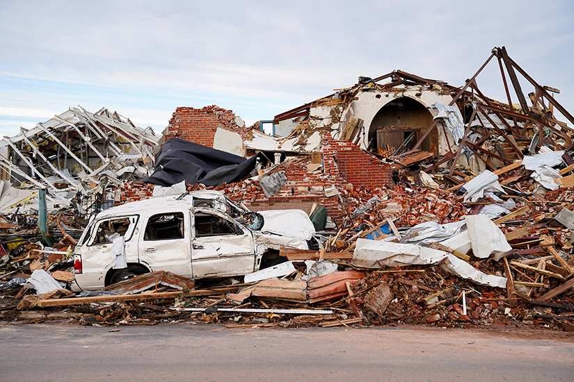 Debris surrounds a destroyed home in Mayfield, Ky., Dec. 11 after a devastating tornado ripped through the town. More than 30 tornadoes were reported across six states late Dec. 10, and early Dec. 11, killing dozens of people and leaving a trail of devastation. 