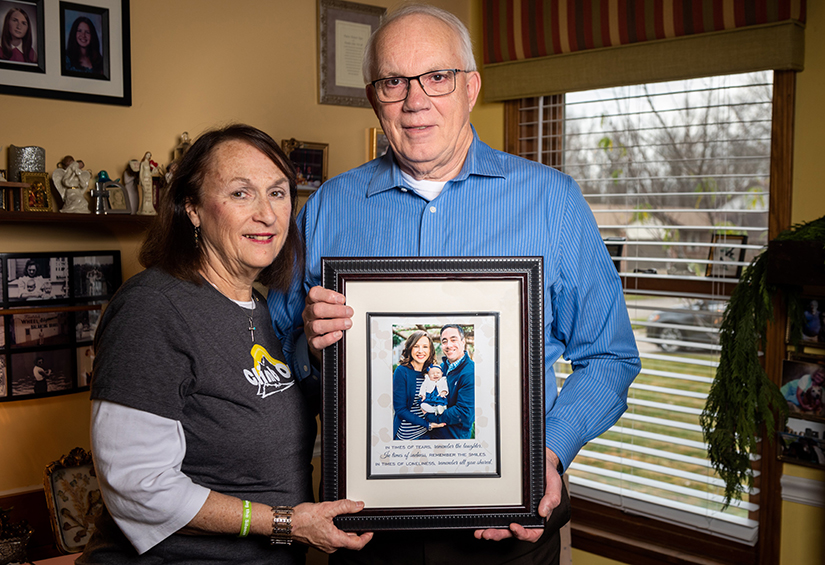 Polly and Frank Fick posed with a photograph of their late daughter Mary Jo Trokey, son-in-law Matthew Trokey and 3-month-old granddaughter Taylor Rose Trokey in their home in Oakville.