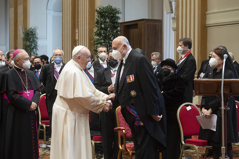 Pope Francis greeted George Poulides, ambassador of Cyprus to the Holy See and dean of the Vatican diplomatic corps, as he arrived for an annual meeting with diplomats accredited to the Holy See, at the Vatican Jan. 10. In his address, the pope called for an urgent reality check against misinformation about COVID-19 vaccines.