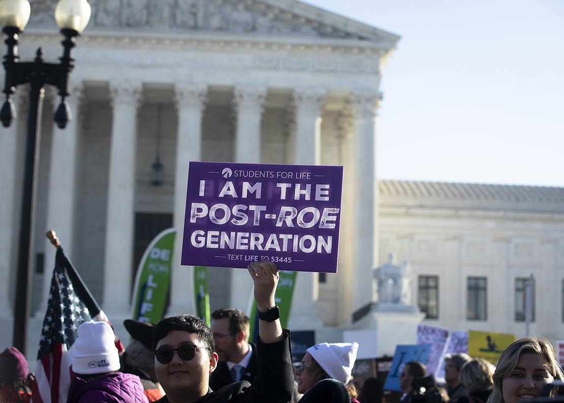 A pro-life advocate joined other demonstrators near the U.S. Supreme Court Dec. 1, the day justices heard oral arguments in a case about a Mississippi law that bans abortions after 15 weeks of gestation.