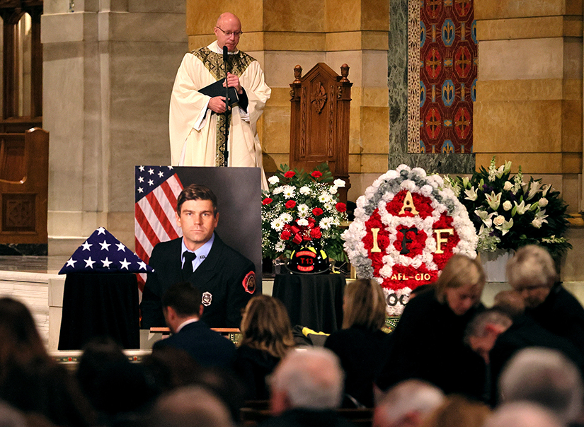 Msgr. Henry Breier celebrated the funeral Massfor St. Louis firefighter Benjamin Polson at the Cathedral Basilica of Saint Louis Jan. 20.