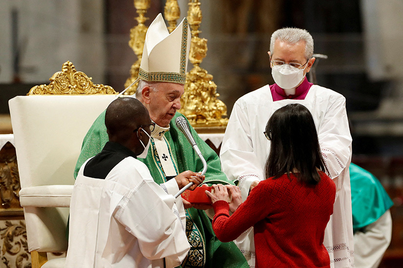 A new lector received a Bible from Pope Francis during a Mass marking Sunday of the Word of God in St. Peter’s Basilica at the Vatican Jan. 23.