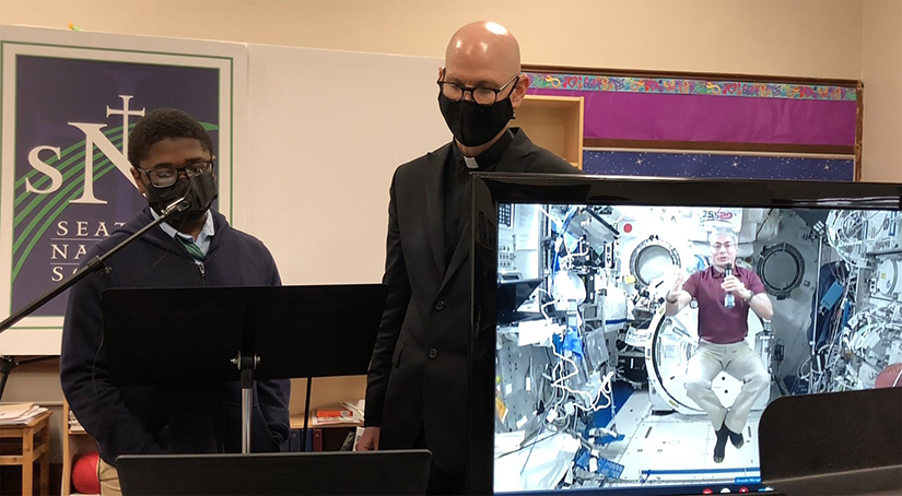 courtesy Seattle Nativity School via Northwest Catholic

Mark Vande Hei, a NASA International Space Station astronaut, took live questions from students at Seattle Nativity School in Washington state. Also pictured is Jesuit Father Jeffrey McDougall, the school’s president.