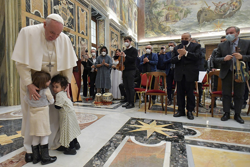 Pope Francis greeted children during an audience with members of the Casa dello Spirito e delle Arti Foundation at the Vatican Feb. 4. The foundation sponsors projects for people with disabilities, refugees, prisoners, single mothers and those recovering from addiction.