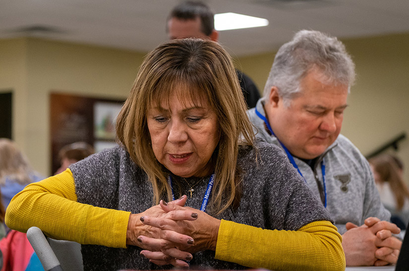 Maria Vlastelin and Dennis Daniels prayed Feb. 5 before the evening meal at SEEK, a multi-day event featuring speakers, times for prayer and the sacraments, deep discussions on relevant issues of the faith and community fellowship. Assumption Church in Mattese opened the virtual event to parishioners.